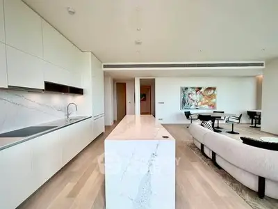 Luxurious open-plan kitchen and living room with modern design and elegant furnishings.