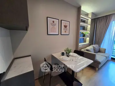 Modern living room with dining area, stylish decor, and natural light from large windows.