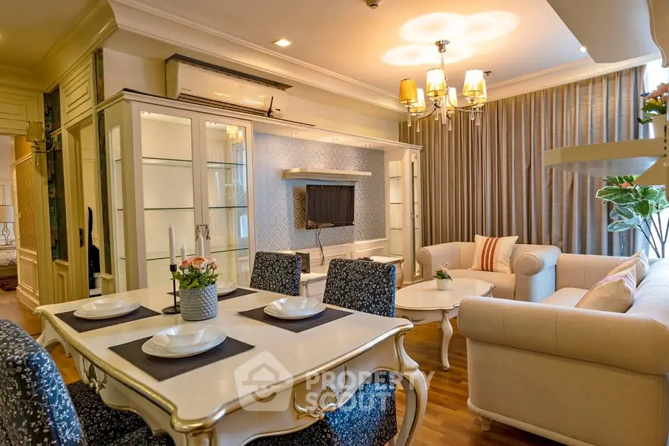 Elegant living room with classic furniture and stylish decor in a cozy apartment setting.