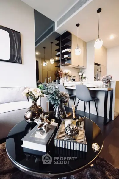 Modern living room with stylish decor and open kitchen layout