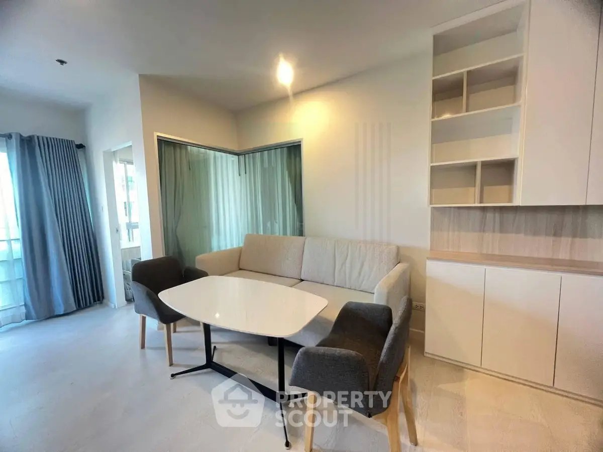 Modern living room with stylish furniture and built-in shelving, perfect for cozy gatherings.