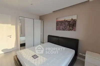 Modern bedroom with sleek design and large wardrobe