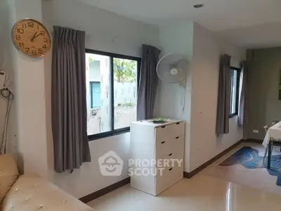 Bright living room with modern decor and large windows, perfect for natural light lovers.
