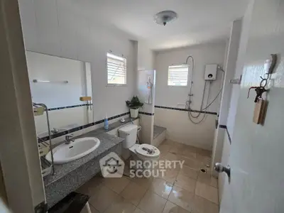 Spacious bathroom with modern fixtures and natural light