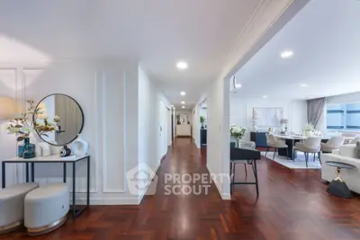 Spacious modern living area with elegant decor and hardwood floors
