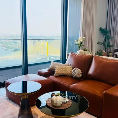 Luxurious living room with leather sofa and stunning balcony view