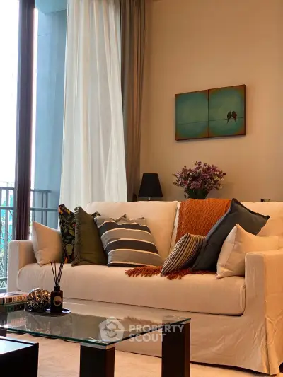 Cozy living room with elegant sofa and stylish decor, perfect for relaxation.