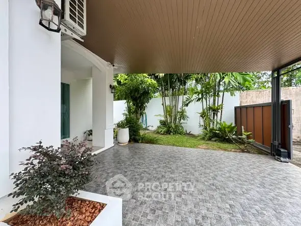 Spacious covered patio with garden view in modern home