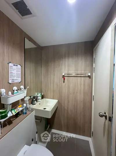 Modern bathroom with sleek design and wood paneling