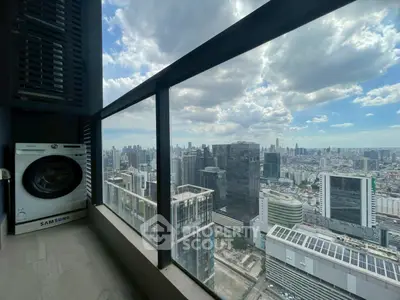 Stunning city view from high-rise balcony with washing machine