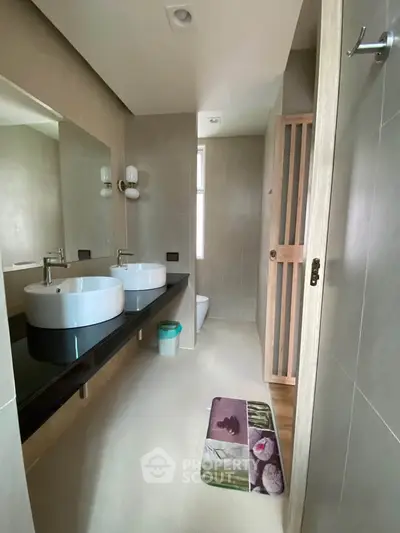 Modern bathroom with dual sinks and stylish decor