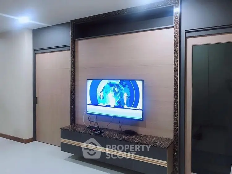 Modern living room with sleek TV setup and stylish decor