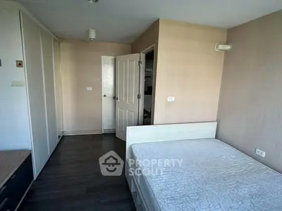 Spacious bedroom with modern design and ample storage space