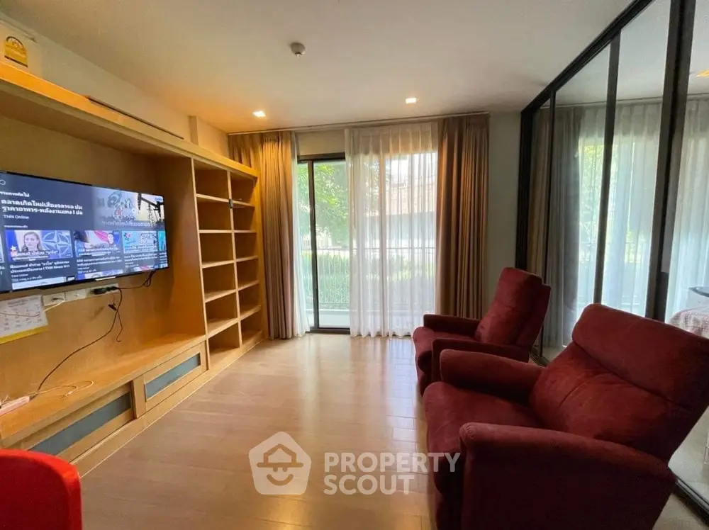 Cozy living room with modern entertainment setup and garden view