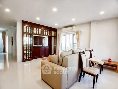 Spacious living room with elegant furniture and large windows