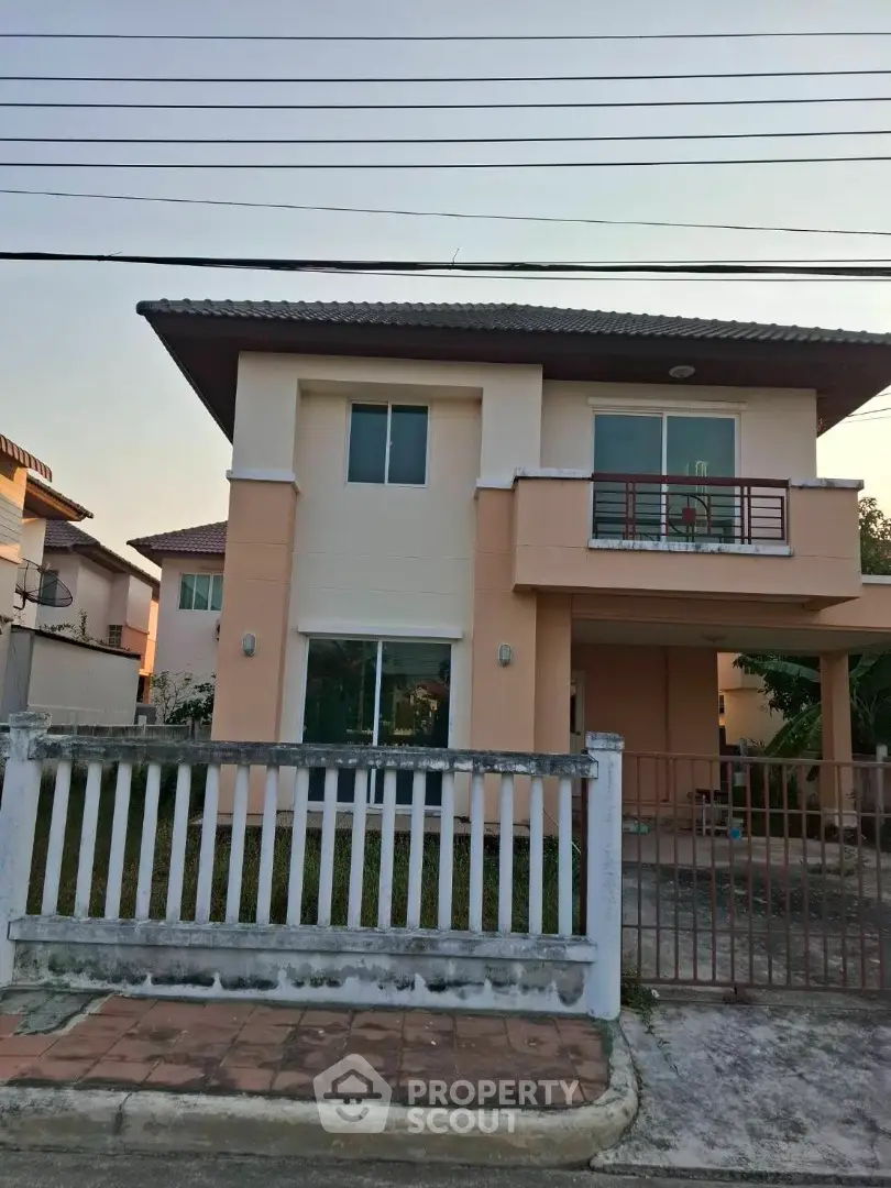 Charming two-story house with modern design and spacious front yard in a serene neighborhood.