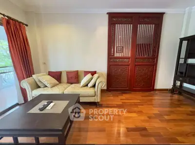 Elegant living room with wooden flooring and traditional decor