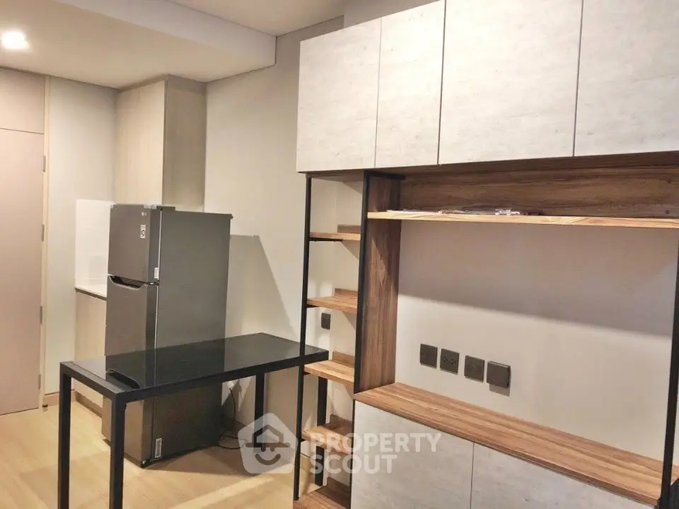 Modern kitchen with sleek cabinetry and stainless steel fridge