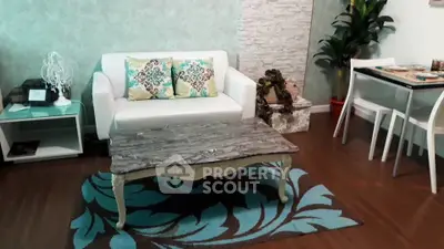 Charming living room with stylish decor and cozy seating area