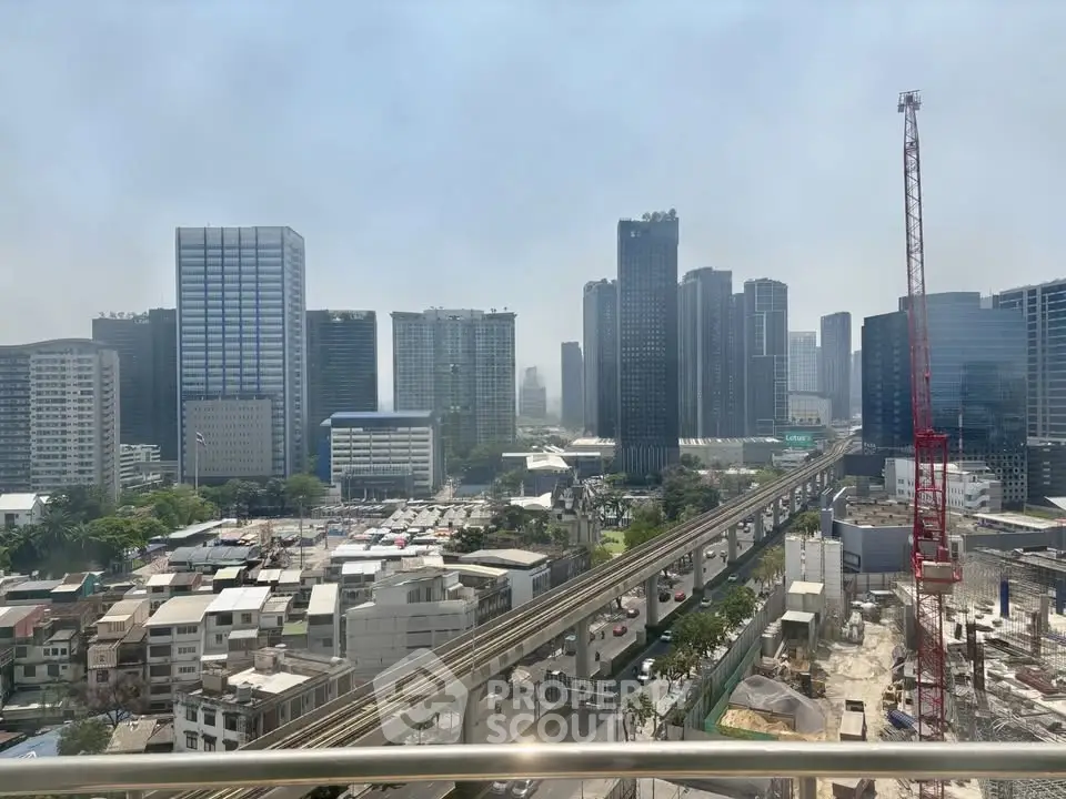 Stunning cityscape view with modern skyscrapers and construction crane, showcasing urban development.