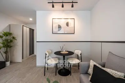 Modern living room with stylish decor and cozy seating area.