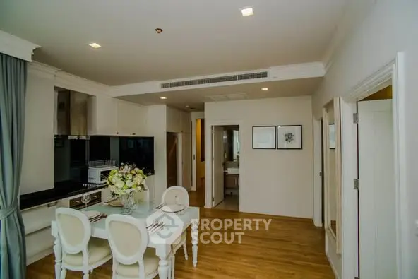 Elegant dining area with modern kitchen in a stylish apartment
