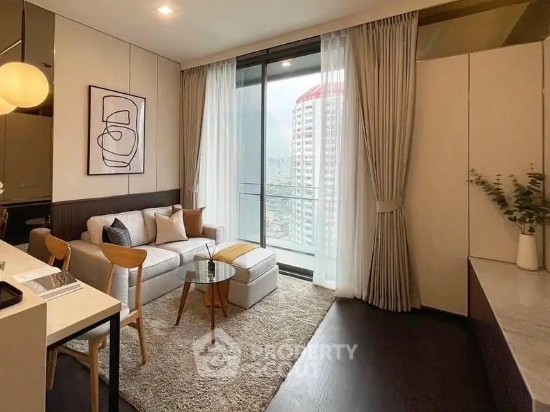 Stylish modern living room with balcony view in high-rise apartment