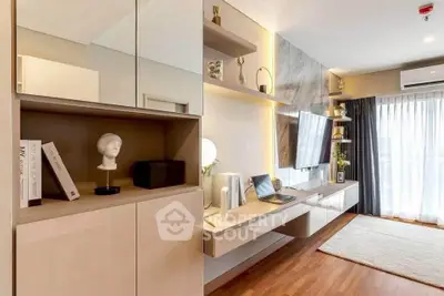 Modern living room with sleek design, wooden flooring, and natural light from large windows.