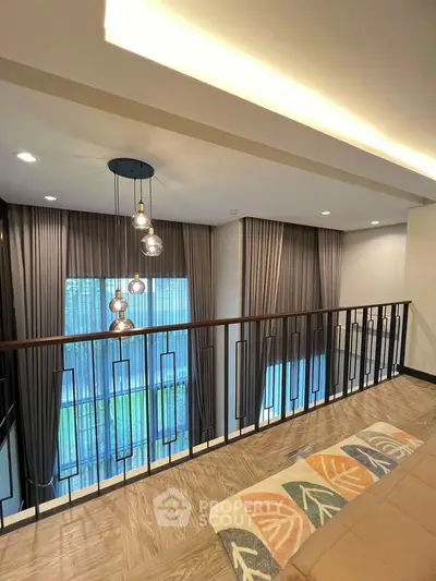 Modern interior with stylish lighting and elegant curtains in a spacious living area.