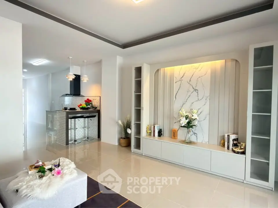 Modern open-plan living room with stylish kitchen and elegant decor