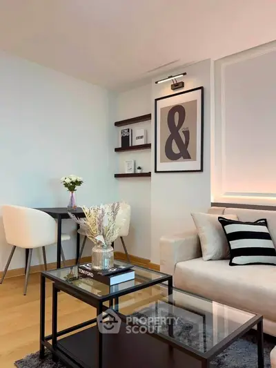 Stylish modern living room with elegant decor and cozy seating area.