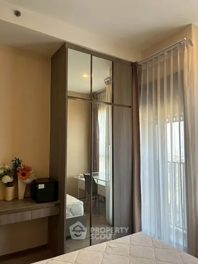 Modern bedroom with mirrored wardrobe and elegant decor