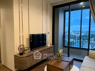Modern living room with balcony view, stylish decor, and natural light.