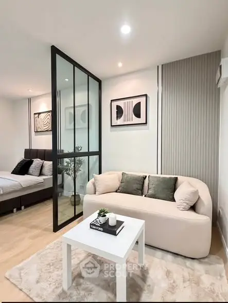 Modern living room with stylish decor and cozy seating area in a contemporary apartment.