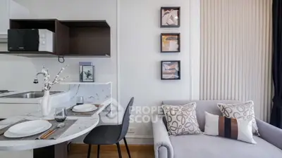 Modern open-plan kitchen and living area with stylish decor and dining setup.
