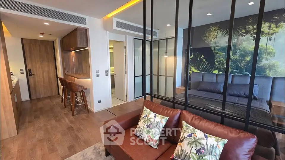 Modern studio apartment with stylish glass partition and cozy living area