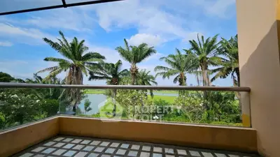 Stunning balcony view with lush greenery and palm trees, perfect for relaxation and enjoying nature.