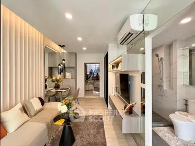 Modern living room with stylish decor and open layout, featuring a cozy seating area and elegant dining space.