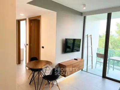 Modern living room with balcony view and stylish furniture
