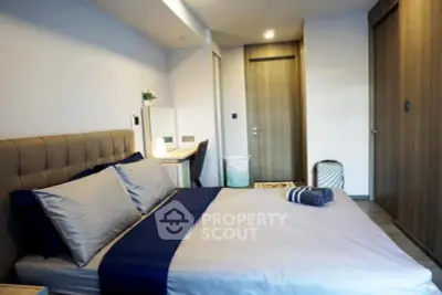 Modern bedroom with stylish decor and ample storage space