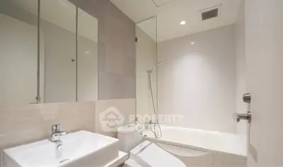 Modern bathroom with sleek design and bathtub in a contemporary apartment.