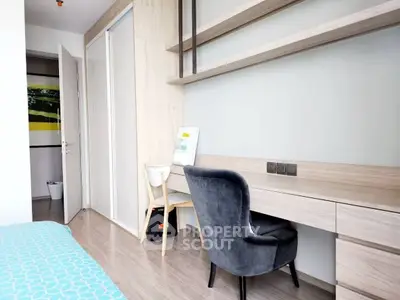 Modern bedroom with study area and sleek wooden finishes