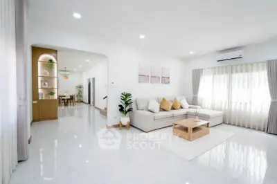 Spacious modern living room with elegant decor and natural light
