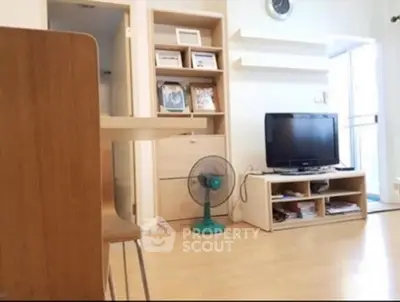 Cozy living room with wooden furniture and TV setup