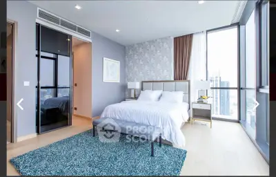 Luxurious modern bedroom with large windows and city view, featuring elegant decor and cozy ambiance.