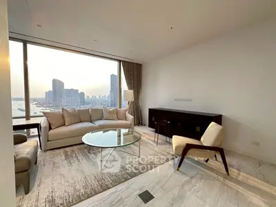 Luxurious living room with stunning city view, elegant furniture, and floor-to-ceiling windows.