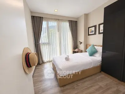 Cozy modern bedroom with natural light and stylish decor