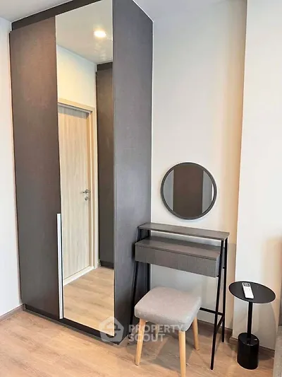 Modern bedroom corner with sleek wardrobe and stylish vanity set