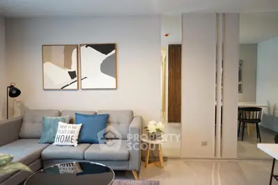 Stylish modern living room with cozy gray sofa and chic decor