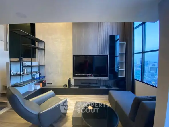 Modern living room with sleek furniture and city view window.